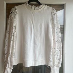 Boden ivory sweatshirt with French eyelet detail.
